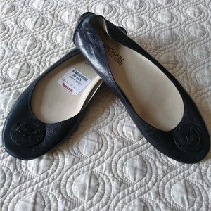 Michael Kors black leather flats with MK logo. New with tags. Size 9